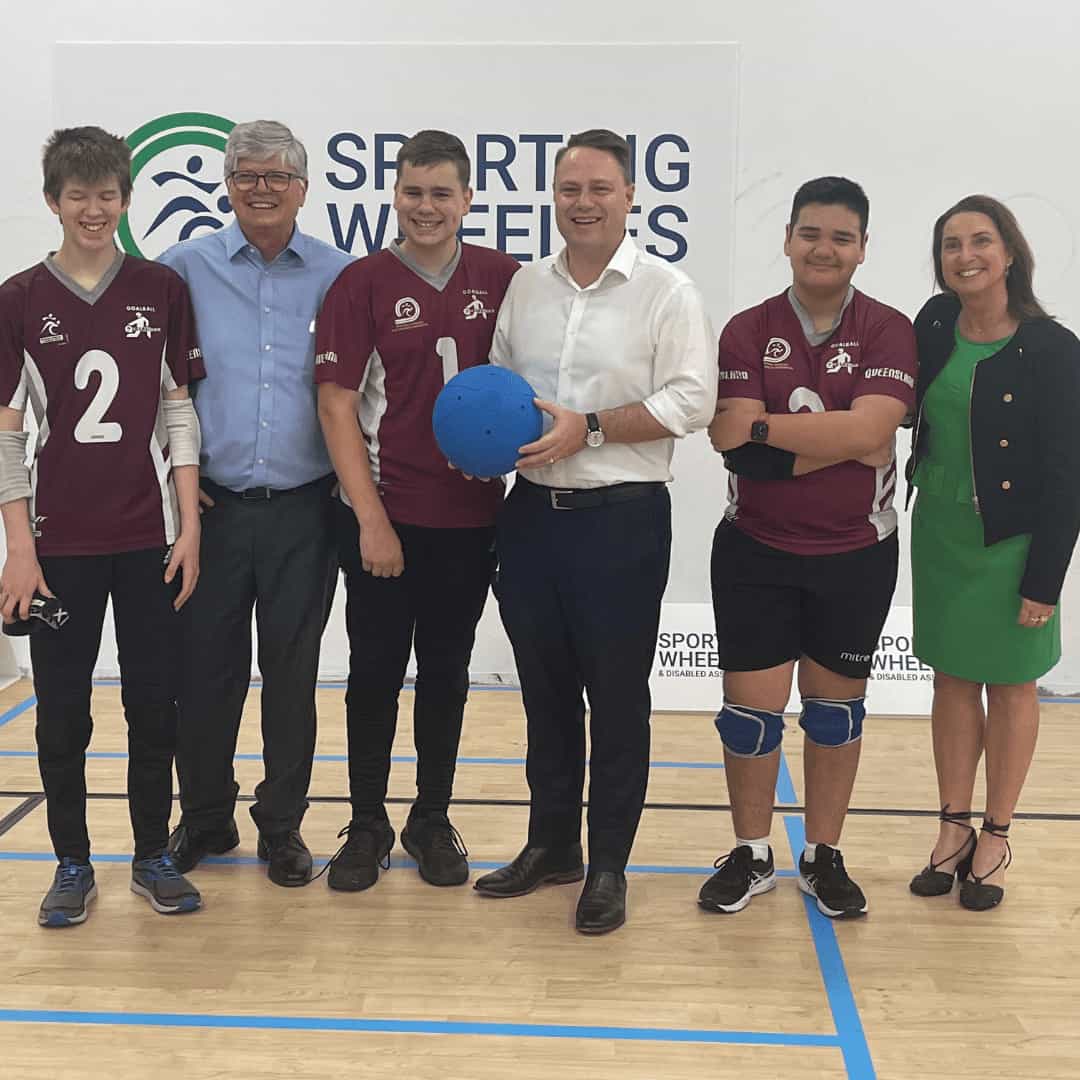The Brisbane lord Mayor standing with CEO Amanda Mather and Queensland goalball players.