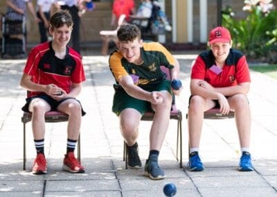 Three boys from different schools play Boccia together during a school visit from Sporting Wheelies.