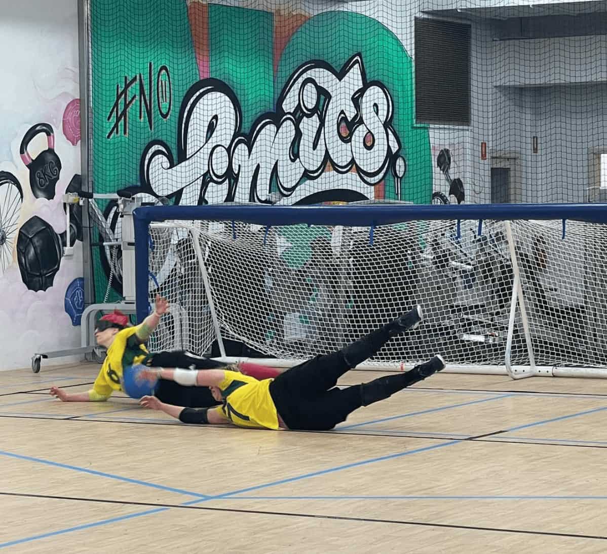Paralympians train for goalball at the Sporting Wheelies Brisbane gym.