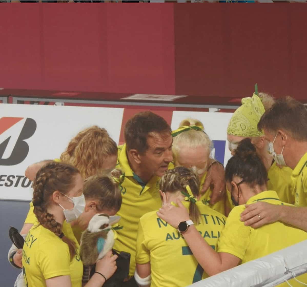 The Australian women goal ball team huddle together at the Paralympics.