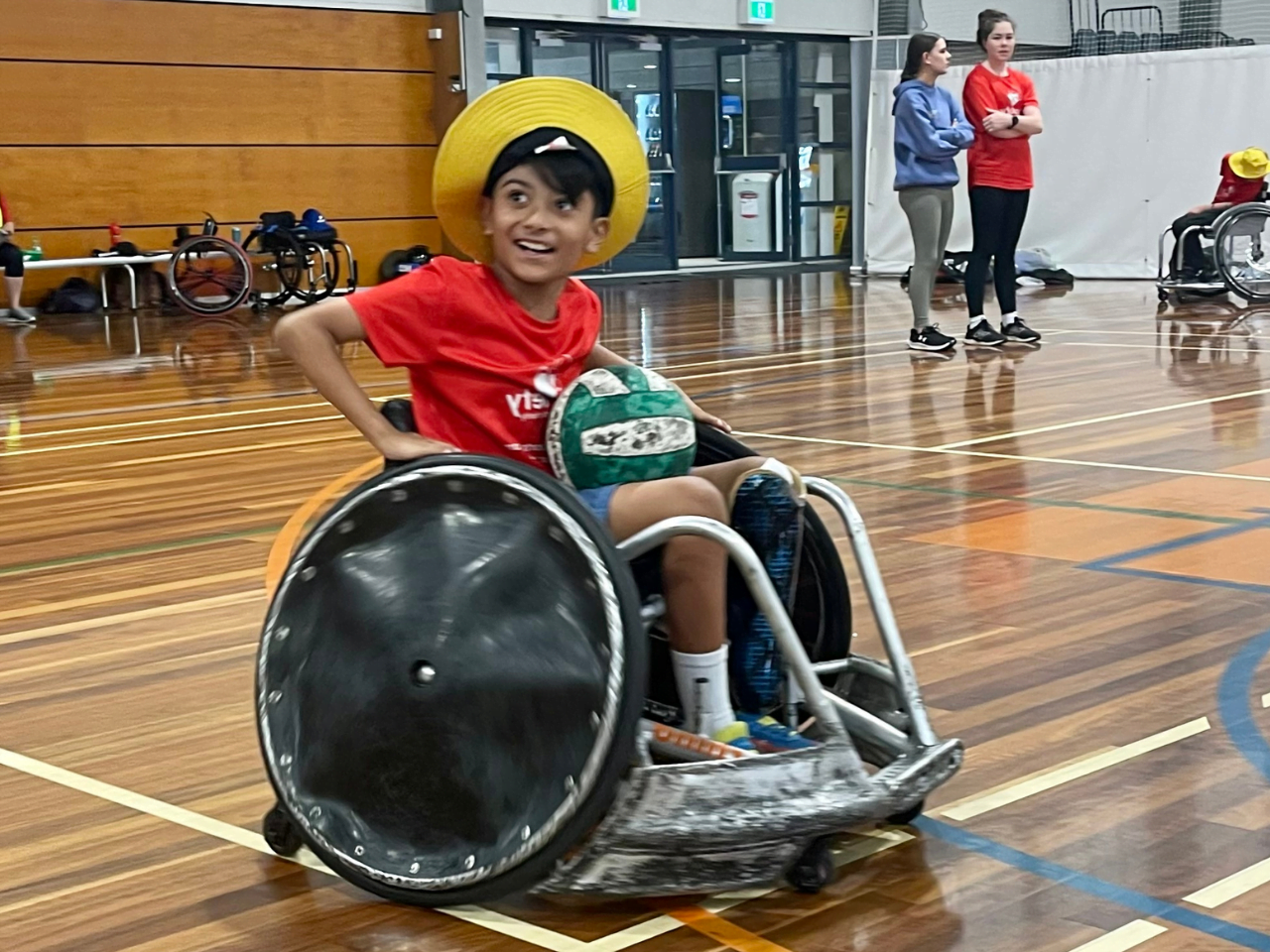 Child enjoying Wheelchair Rughy