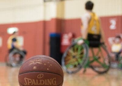 A basketball on the floor during a wheelchair basketball game.