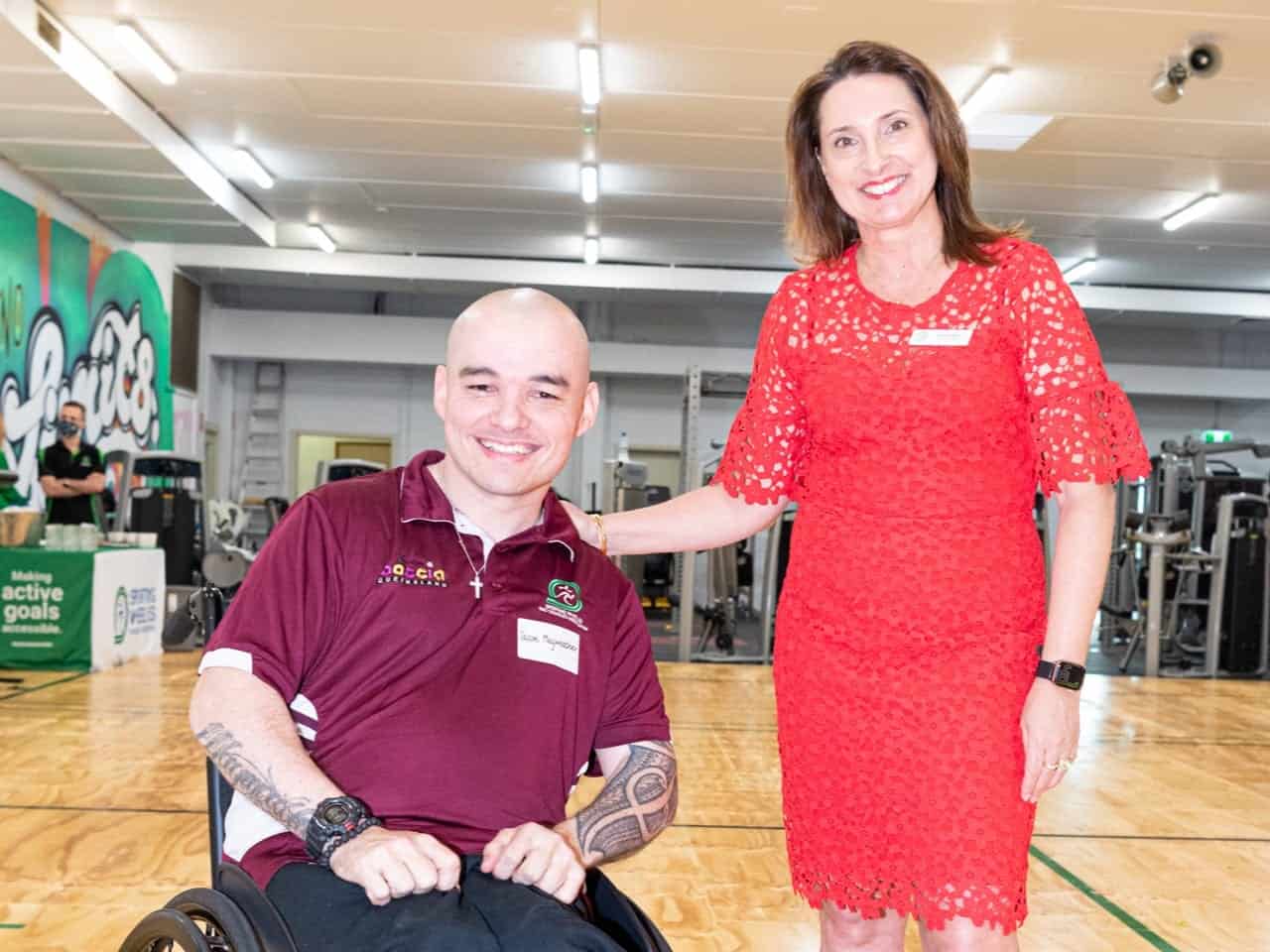 Sporting Wheelies CEO Amanda and Game Changer Jason, come together for a photo at the gym.