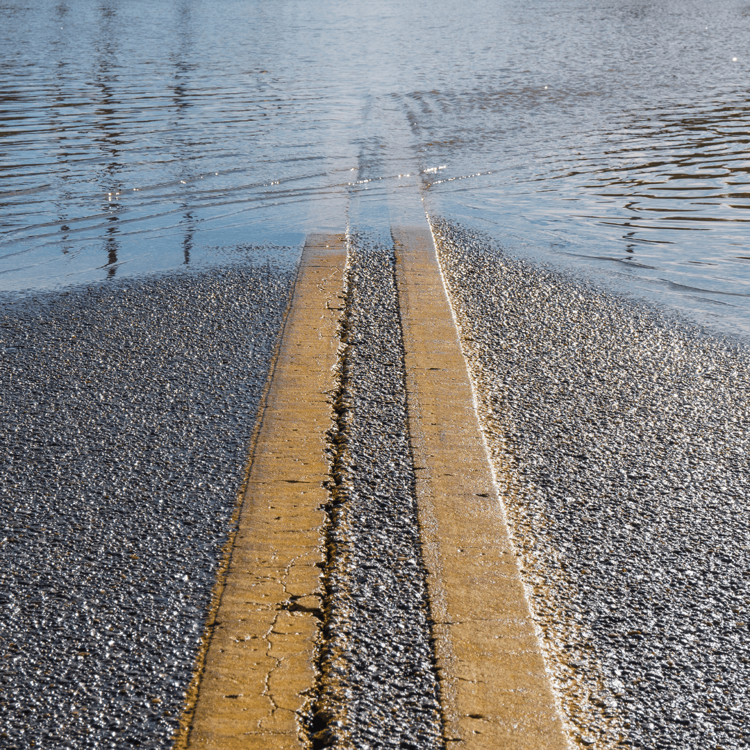 A road that is half flooded.